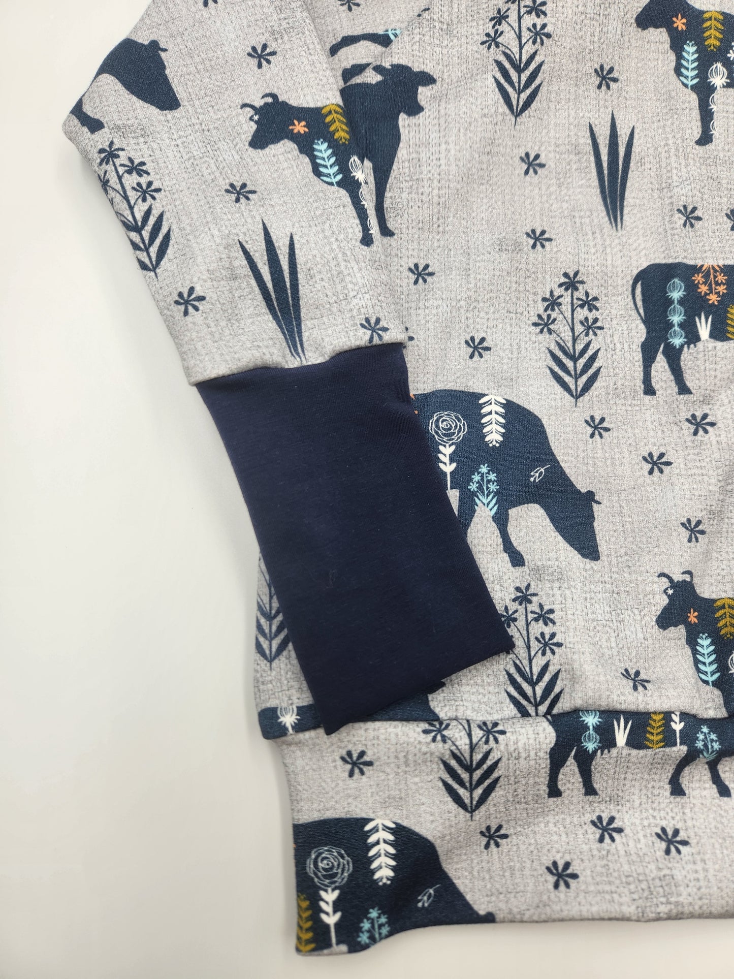MooMoo Meadows Cow Print Grow-with-me Sweater