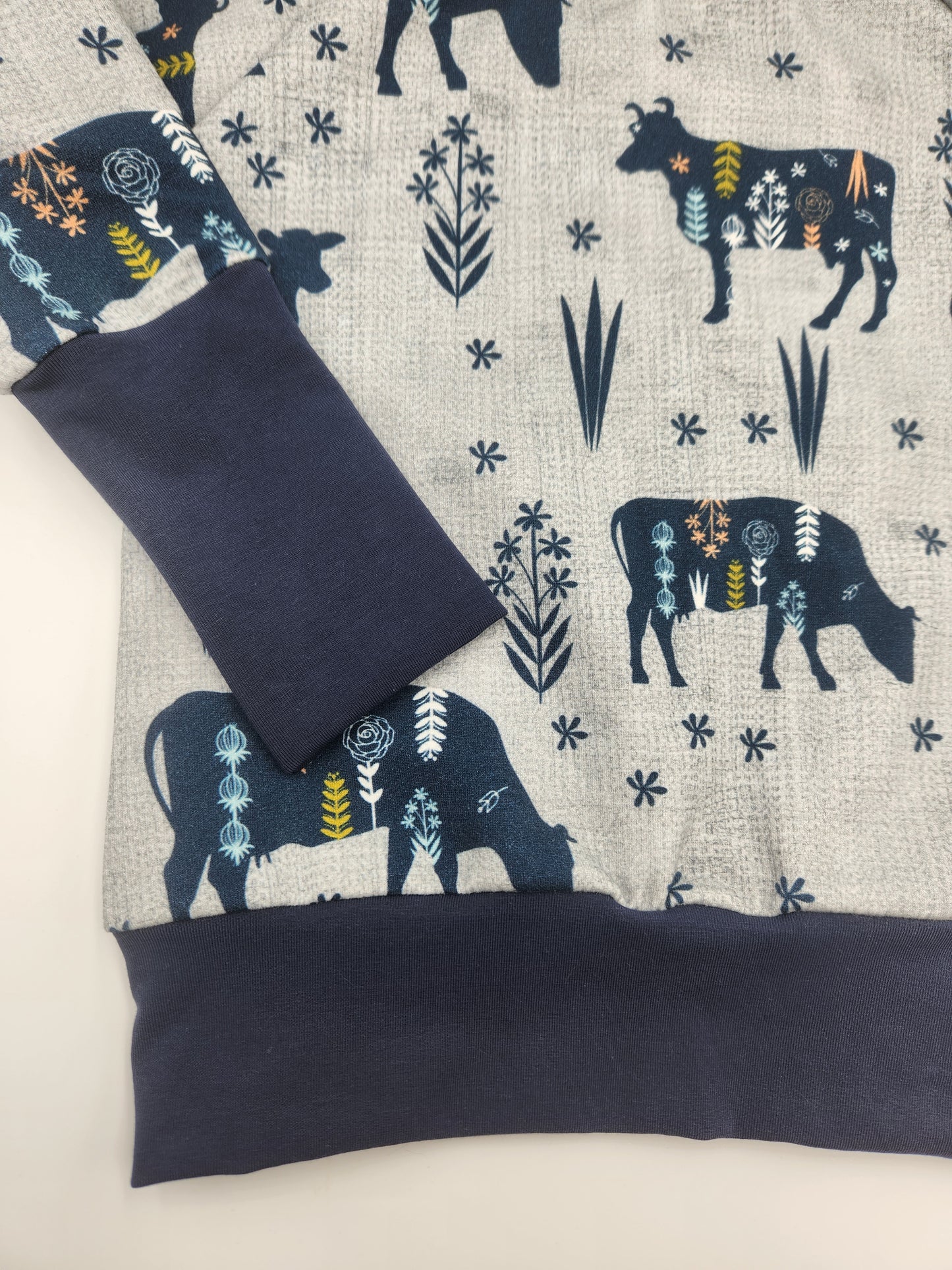 MooMoo Meadows Cow Print Grow-with-me Sweater