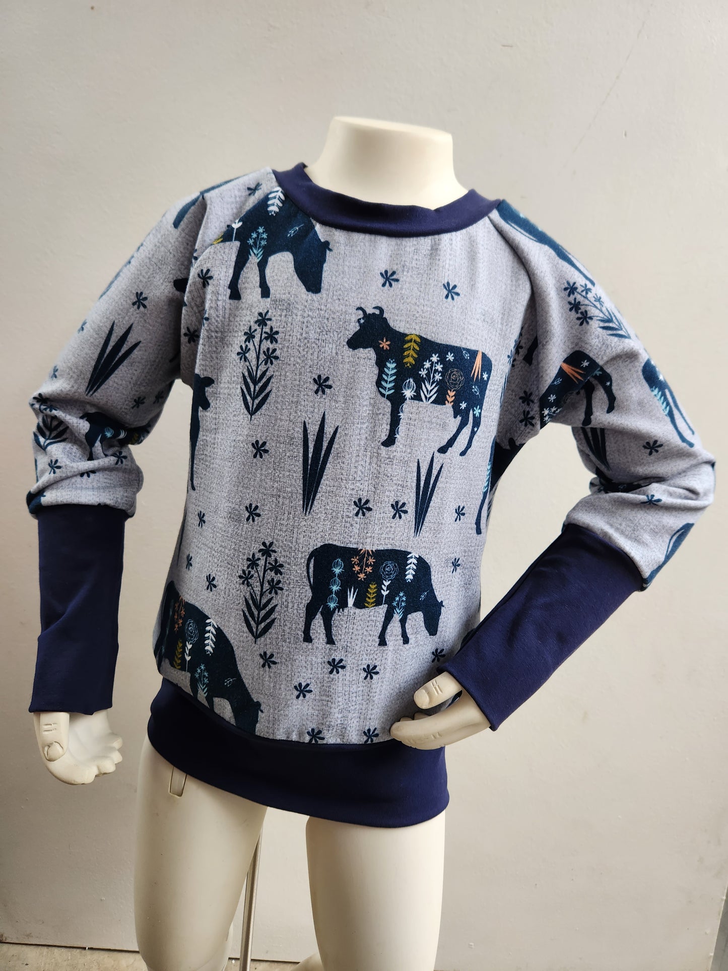 MooMoo Meadows Cow Print Grow-with-me Sweater